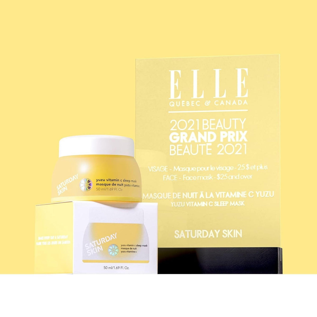 Saturday Skin jar next to hand to show product size and convenient bedside keep