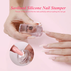 Saviland stamper in use applying a crisp white French tip on a nail