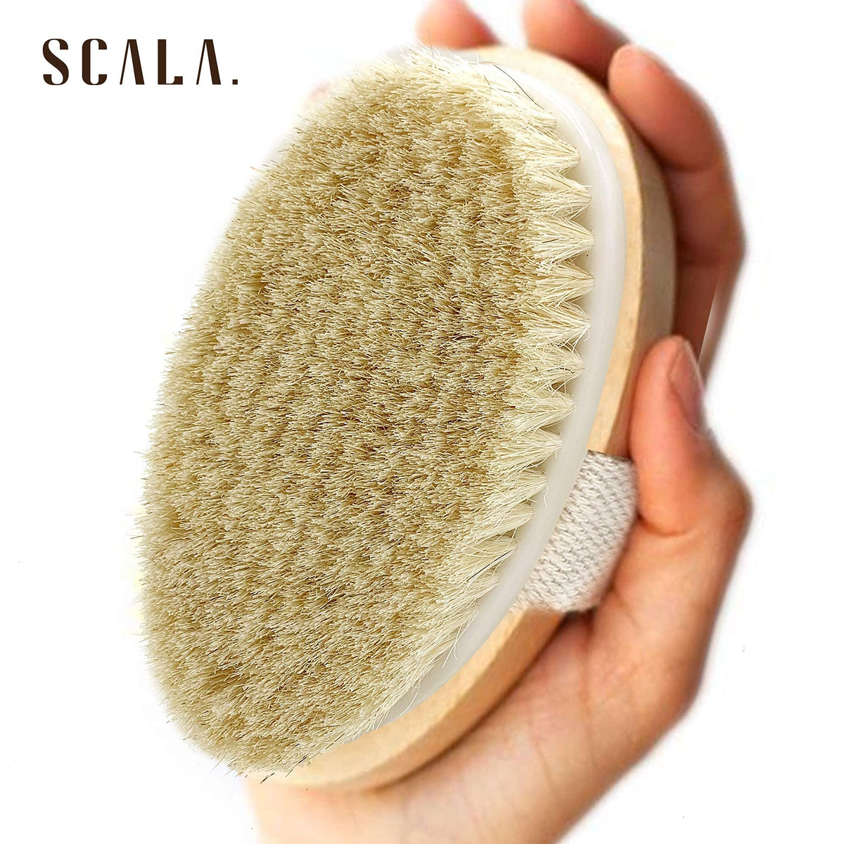 Scala brush held in hand demonstrating secure cotton strap for confident brushing