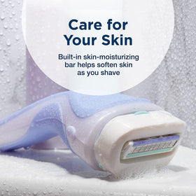 Schick Intuition beside a coin for scale to show compact cartridge size