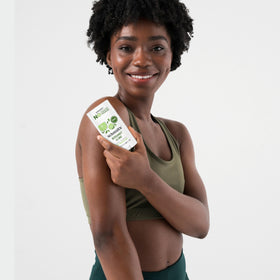 Hand holding a Schmidt's stick to show size and portability, ideal for travel convenience