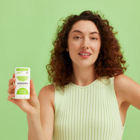 Schmidt's close-up of deodorant stick texture highlighting smooth, non-greasy formula benefit