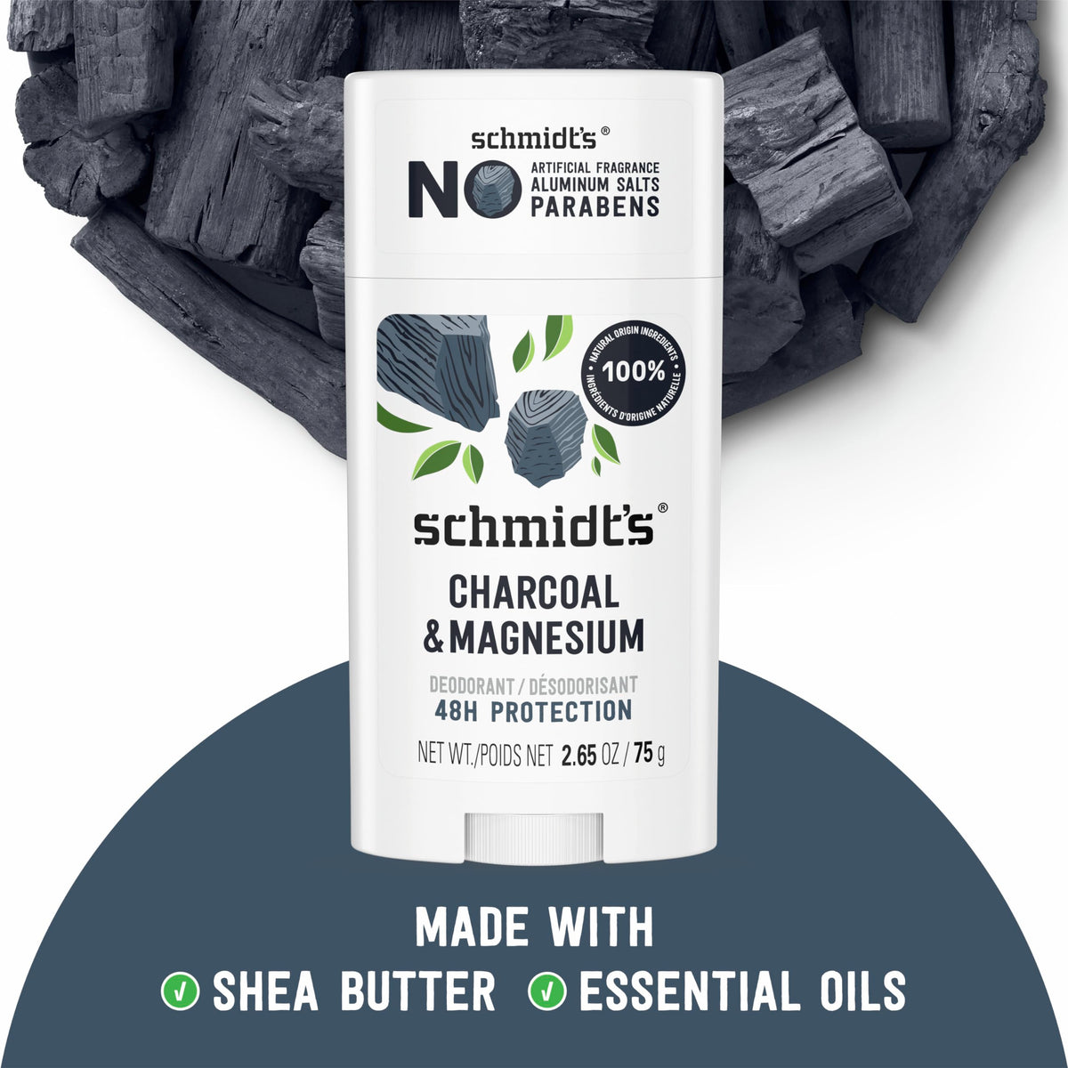 Schmidt's ingredients flatlay with coconut, jojoba, shea, and charcoal highlighting natural origin
