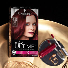 Schwarzkopf Color Ultime finished ruby red hair in lifestyle scene showing glossy results