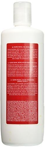 Schwarzkopf developer bottle beside styling tools in salon, aiding workflow