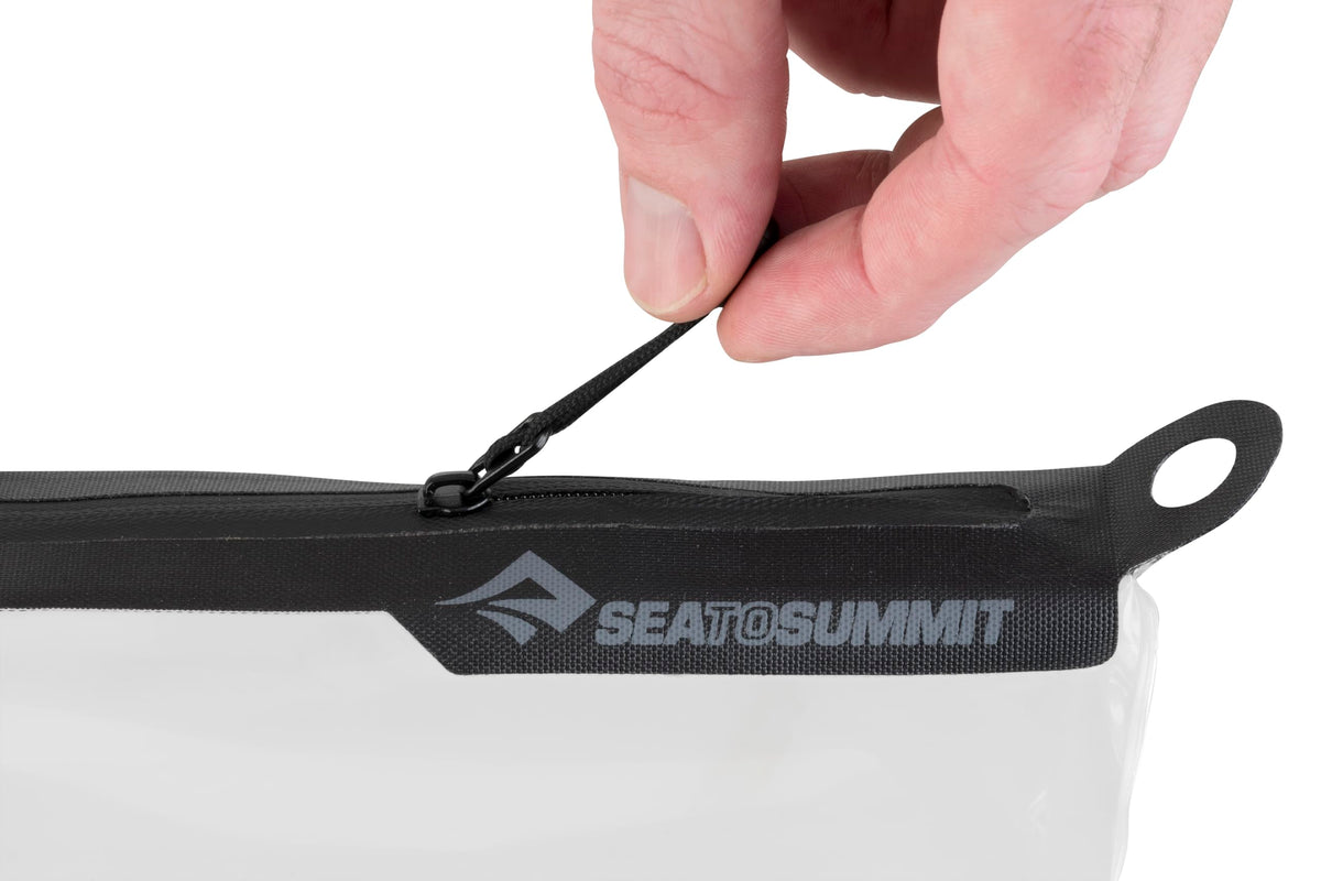 Sea to Summit pouch on bathroom counter showing travel-ready kit for streamlined routines