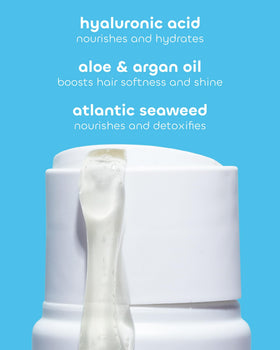 Seaweed Bath Co. 12 oz bottle held in hand to show true size and portability