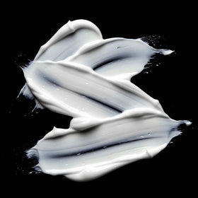 Sebastian product being combed through hair to show reduced tangles