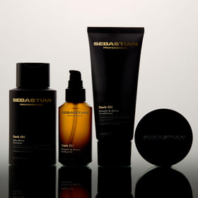 Jojoba and argan oils with Sebastian bottle showing nourishing ingredient benefit