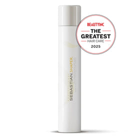 Applying Sebastian Shaper mini to styled hair for flexible, brushable hold