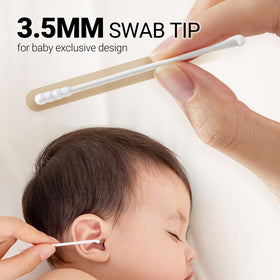 SEEDNUR swab next to hand showing scale and ease of use for parents