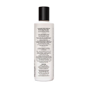 SEEN conditioner texture on hand displaying lightweight slip and detangling benefit