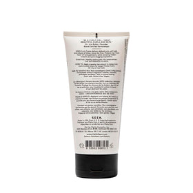 SEEN Curly Creme texture close-up on fingertips demonstrating creamy, non-greasy finish benefit