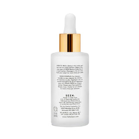 SEEN dropper dispensing clear serum texture close-up demonstrating lightweight absorbent hydration