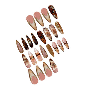 SEENEEY nails held in hand to show almond shape and realistic scale
