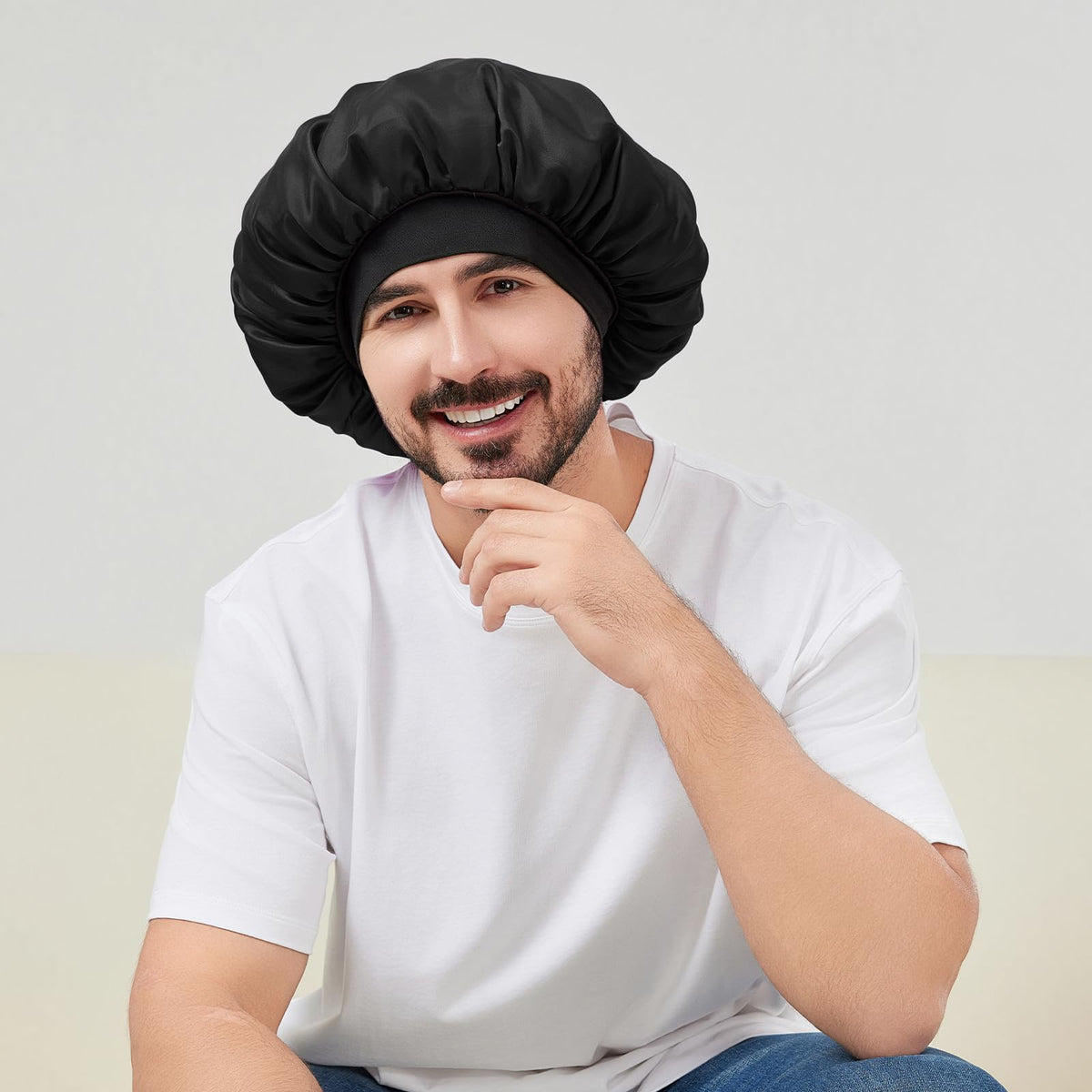 Selalu bonnet size comparison held in hand to demonstrate roomy coverage