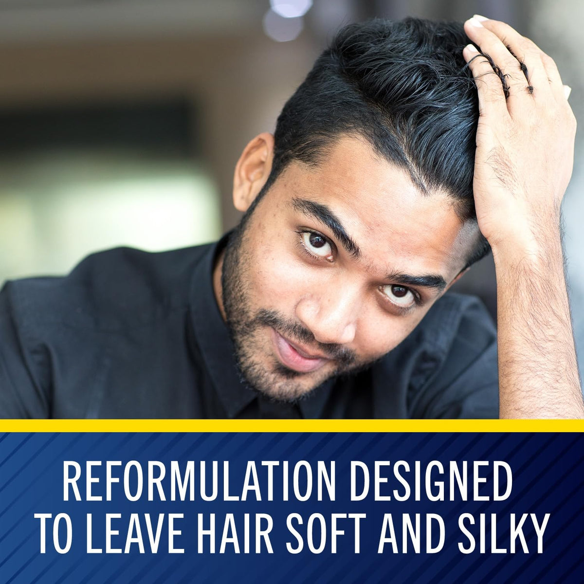Applying Selsun Blue to scalp during wash to illustrate targeted dandruff control and comfort