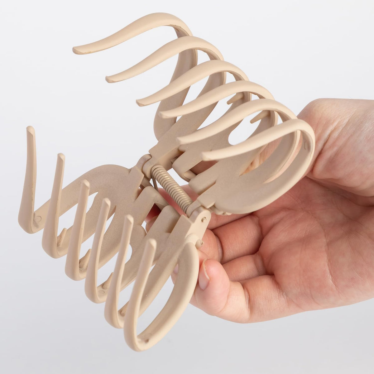 Seneeel size comparison with hand showing 3.8-inch scale for large sections
