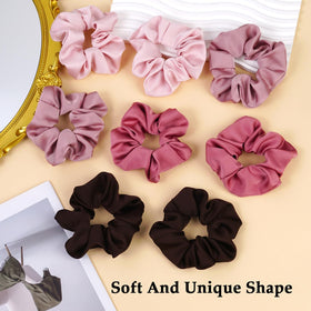SEVEN STYLE scrunchies in a hand for scale, shows flexible fit for different hair types