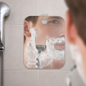 Shave Well mirror beside a passport showing portable travel benefit