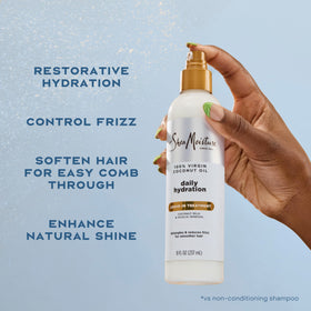 Shea Moisture being sprayed on damp hair for detangling and smoothness
