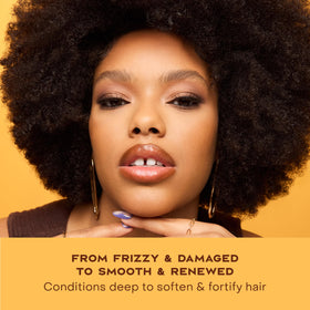 Shea Moisture bottle on bathroom shelf in a styled routine setting