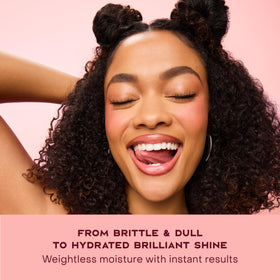 Shea Moisture finished sleek updo showcasing smooth, frizz-controlled shine and polished style