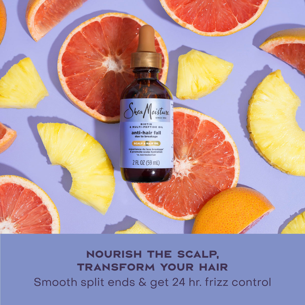 Shea Moisture oil being massaged into scalp to reduce breakage