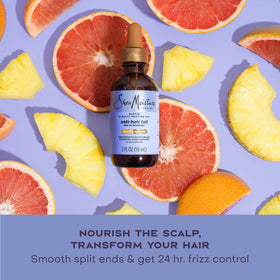 Shea Moisture oil being massaged into scalp to reduce breakage