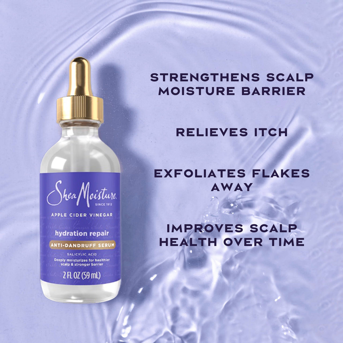 SheaMoisture 2 fl oz bottle beside a coin for scale to show compact travel-friendly size