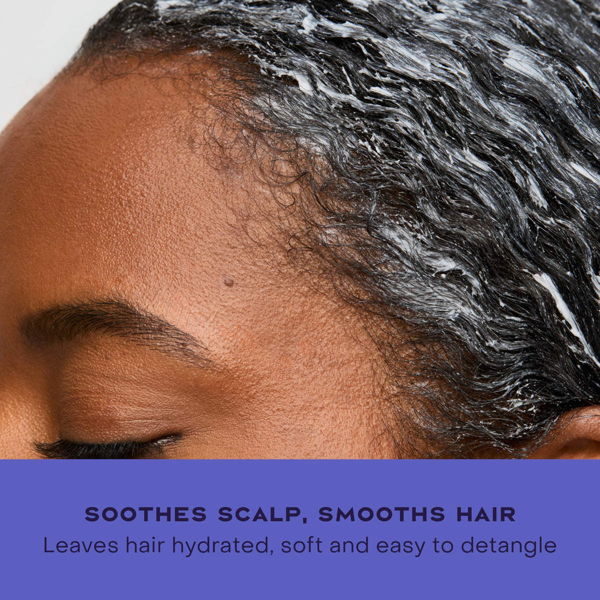 SheaMoisture conditioner being applied in shower to soothe itchy scalp