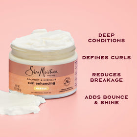 SheaMoisture being applied to wet hair for deep conditioning benefit
