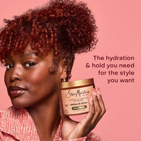 SheaMoisture applying gel to damp curls for defined, frizz-free results