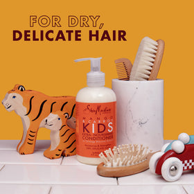 SheaMoisture creamy conditioner dollop demonstrating smooth slip