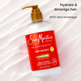 SheaMoisture product being used to detangle wet curls gently