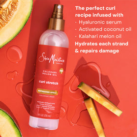 SheaMoisture misting on curly hair demonstrating quick refresh