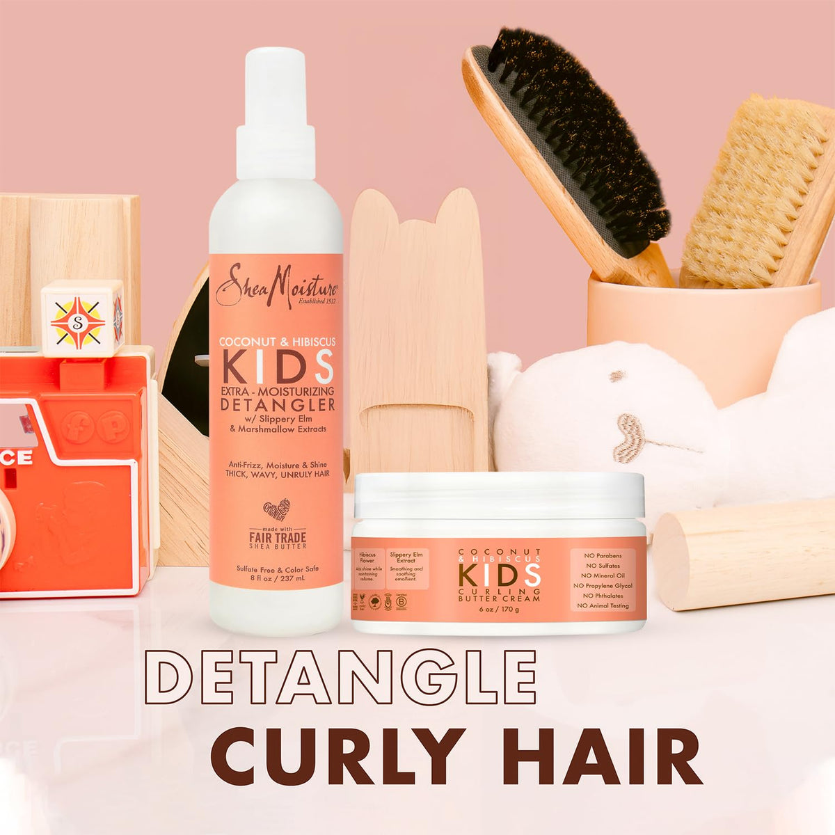 SheaMoisture detangler spray bottle focused on mist delivery for gentle slip