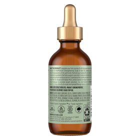 SheaMoisture dropper applying oil to scalp for targeted nourishment