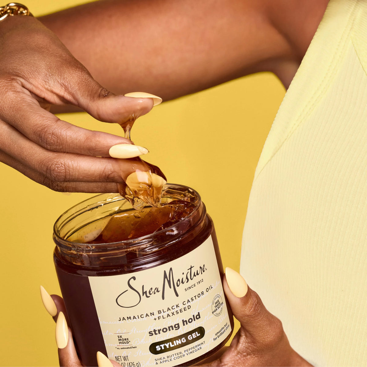 SheaMoisture ingredient label close-up showing castor oil, shea butter benefits