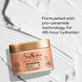 SheaMoisture jar beside coconut and hibiscus emphasizing natural ingredient benefits