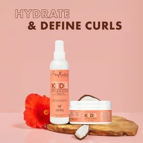 SheaMoisture styled child with defined curls demonstrating soft, bouncy results