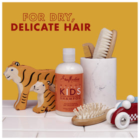 Shea Moisture mango and carrot ingredients closeup showing natural extracts