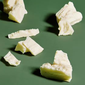 SheaMoisture label close-up highlighting Fair Trade shea butter sourcing benefit