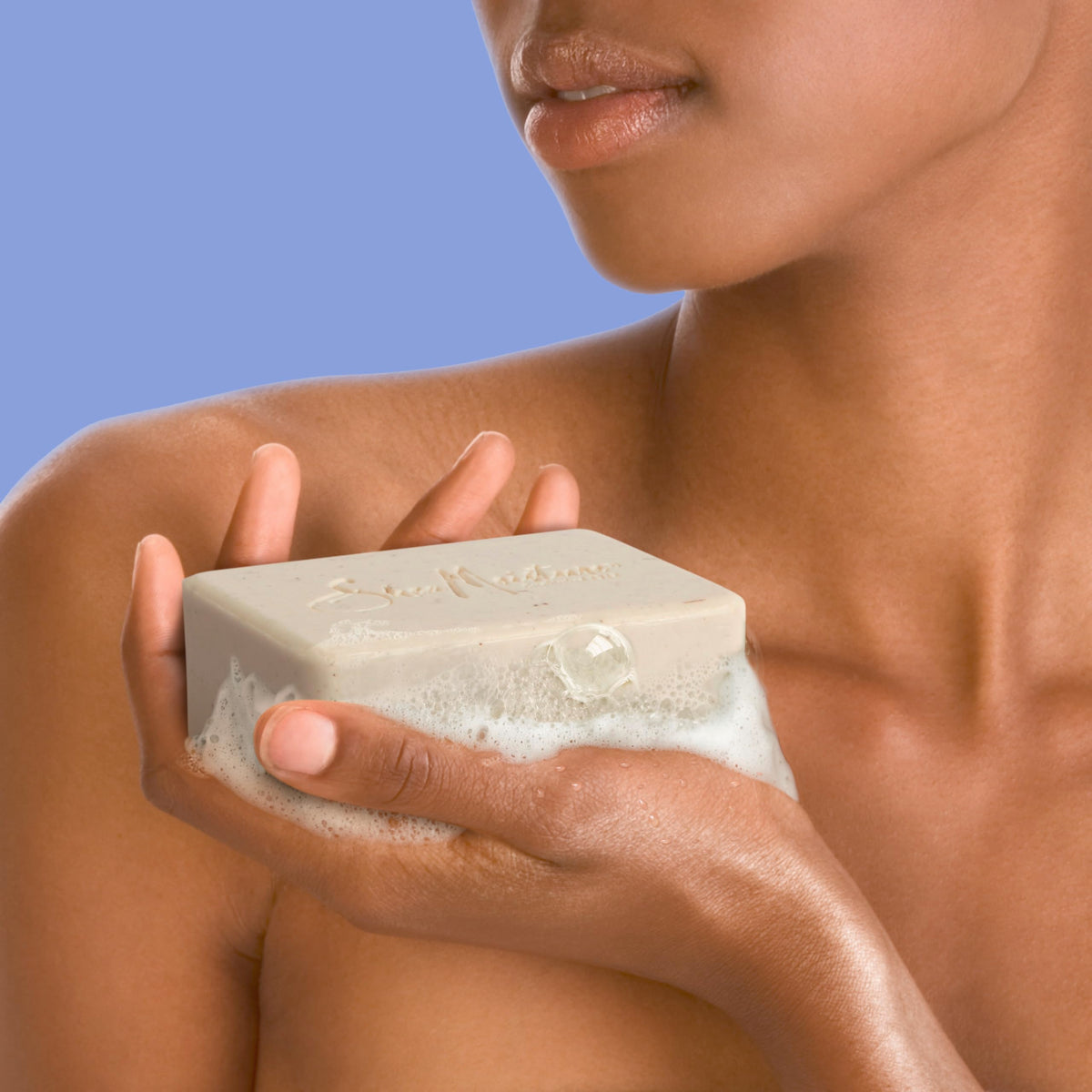 SheaMoisture bar soap in bathroom setting showing everyday use and visible hydration