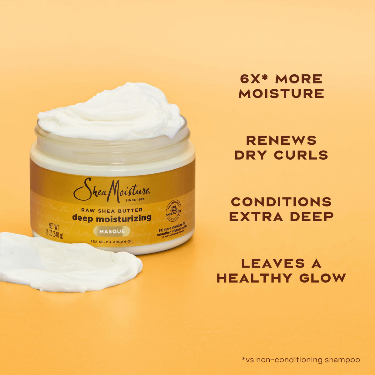 Hand scooping SheaMoisture masque to demonstrate easy application and deep conditioning