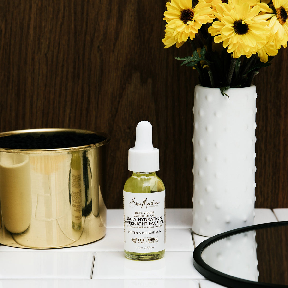 SheaMoisture open bottle with oil dropper showing smooth absorbent texture
