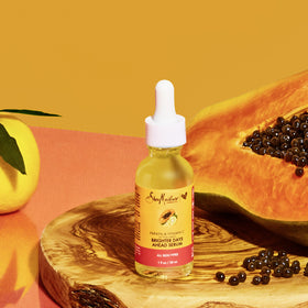 SheaMoisture serum in nighttime routine setting showing layering with moisturizer