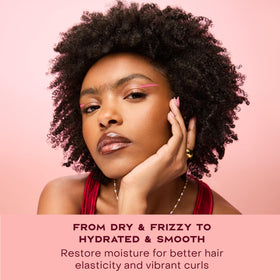 SheaMoisture 13 oz bottle in hand to show true product size