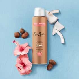 SheaMoisture 4 oz can next to a hand showing compact size and travel-friendly benefit