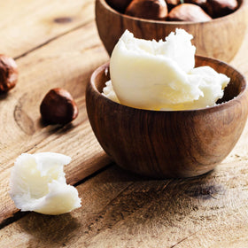 Sheanefit in a bowl being mixed for DIY body butter and personalization